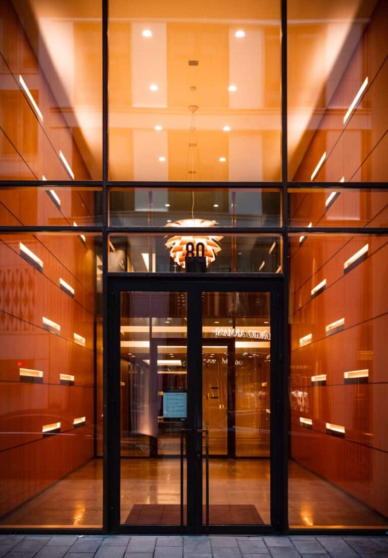 Elegant glass door entrance of a modern building in Hamburg, Germany.